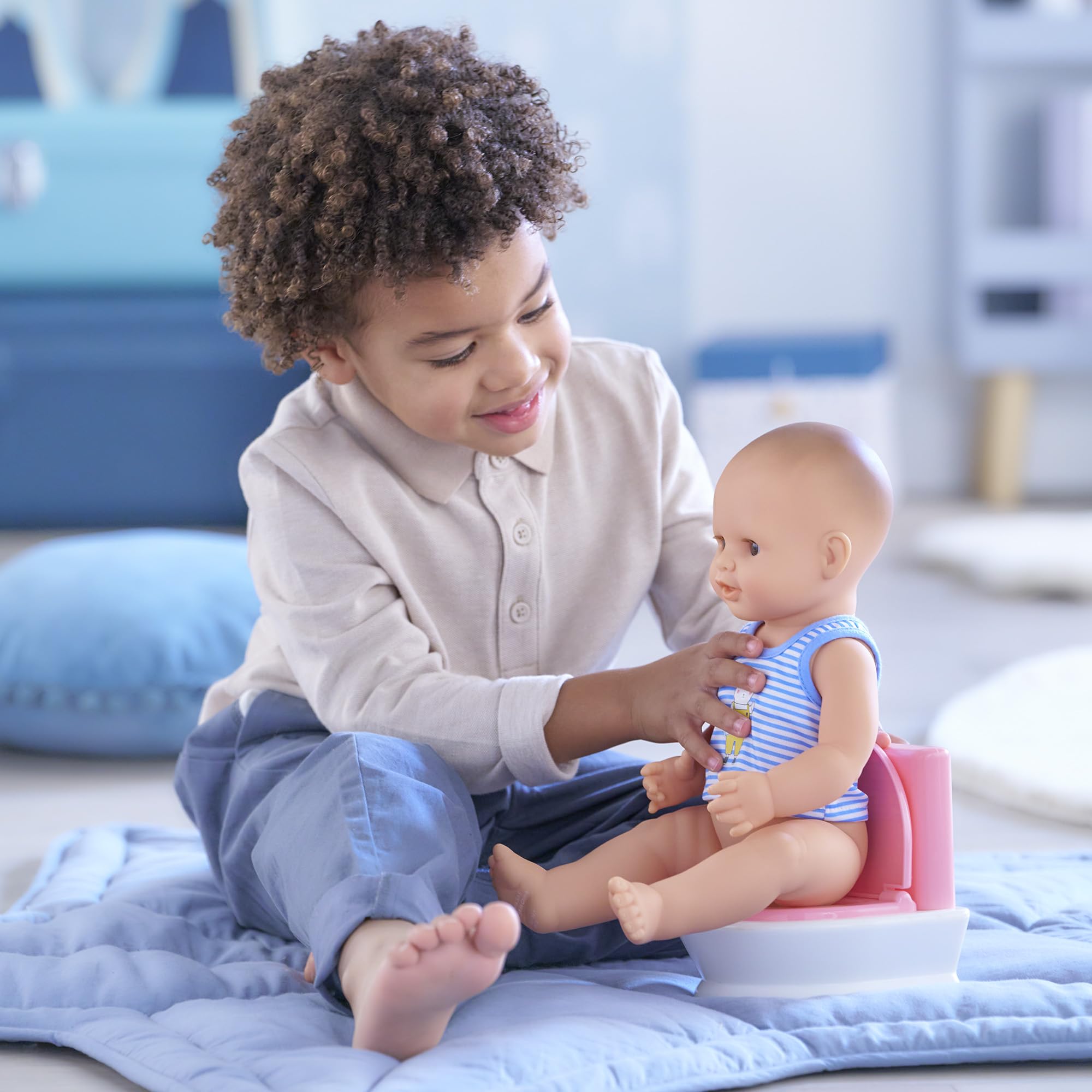 Corolle interactive doll potty set supports learning through imitation and pretend play.