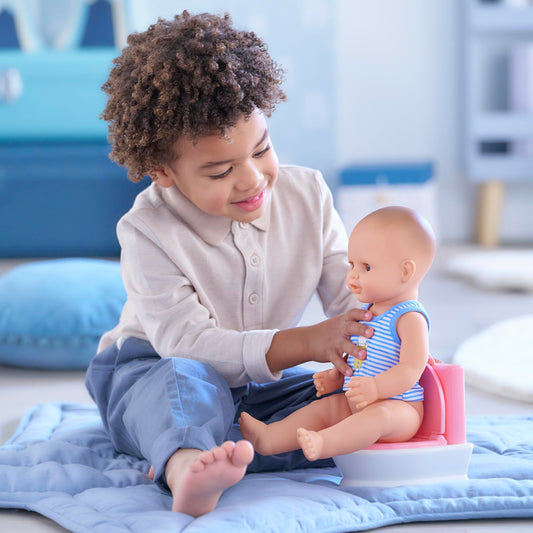 Corolle interactive doll potty set supports learning through imitation and pretend play.