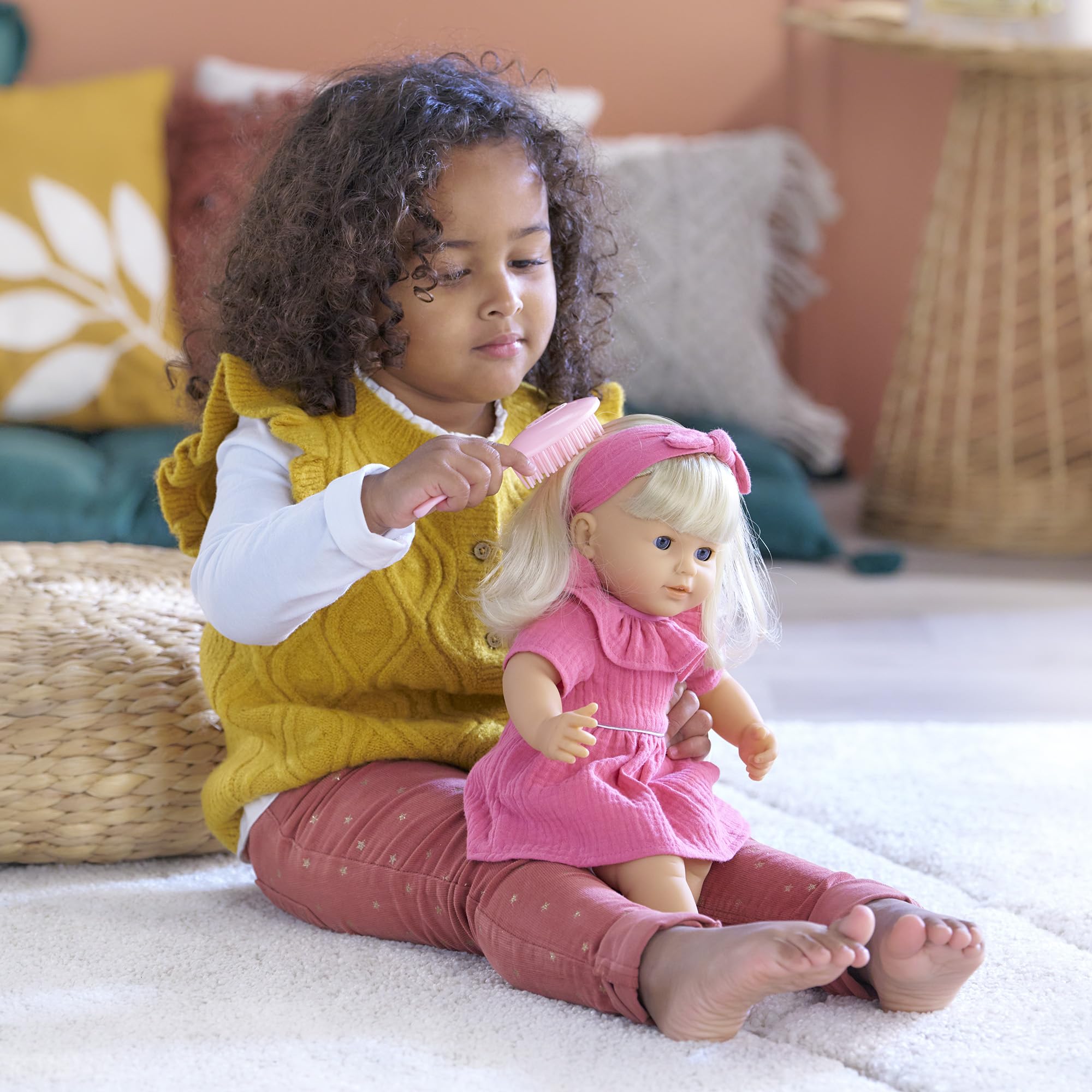Corolle Jade soft bean-filled body is lightweight for little hands.