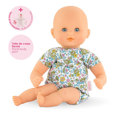 Corolle doll cap and outfit create adorable bedtime visuals.