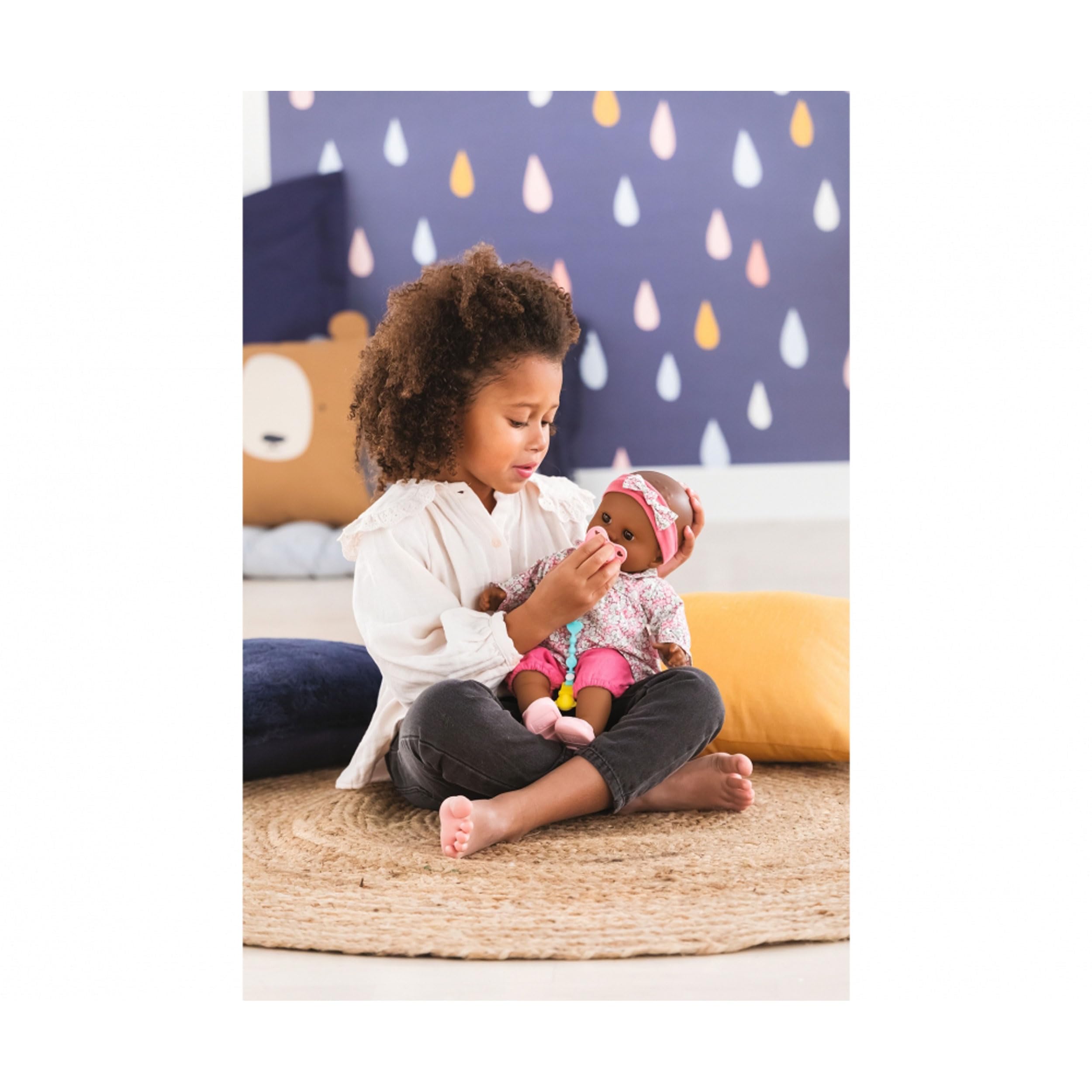 Corolle pacifier battery compartment shown with included batteries for immediate use