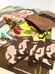 Covered Wagon Games I Caught Bigfoot age 6 plus label supports family play.