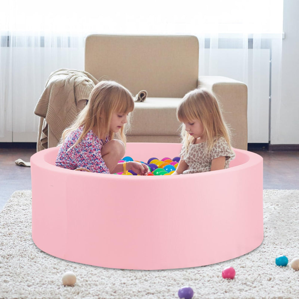 COZYTRAUM ball pit pink arranged in a cozy room setup for play