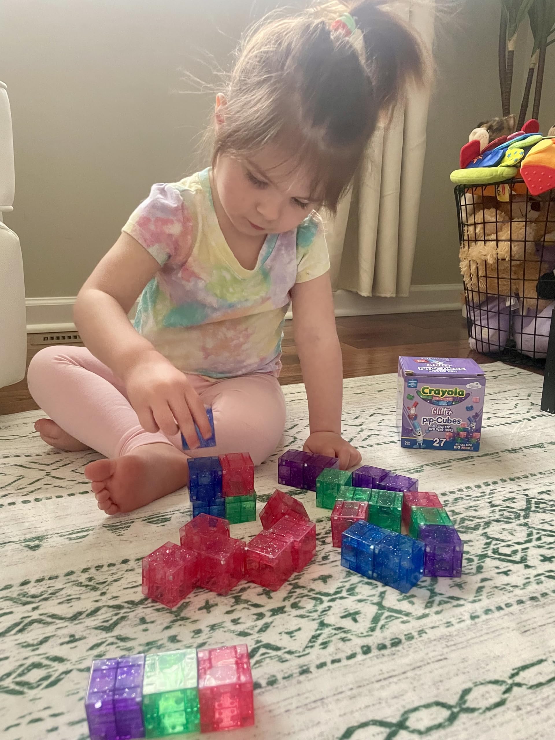 CreateOn Crayola Glitter Magnetic PIP Cubes building a tall colorful tower