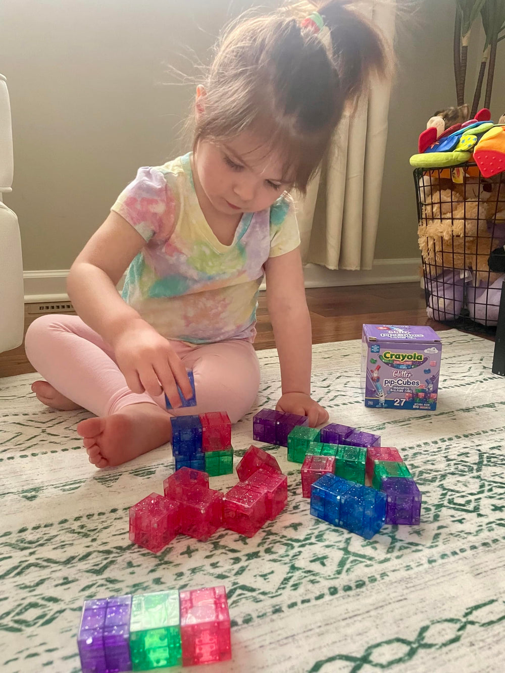 CreateOn Crayola Glitter Magnetic PIP Cubes building a tall colorful tower