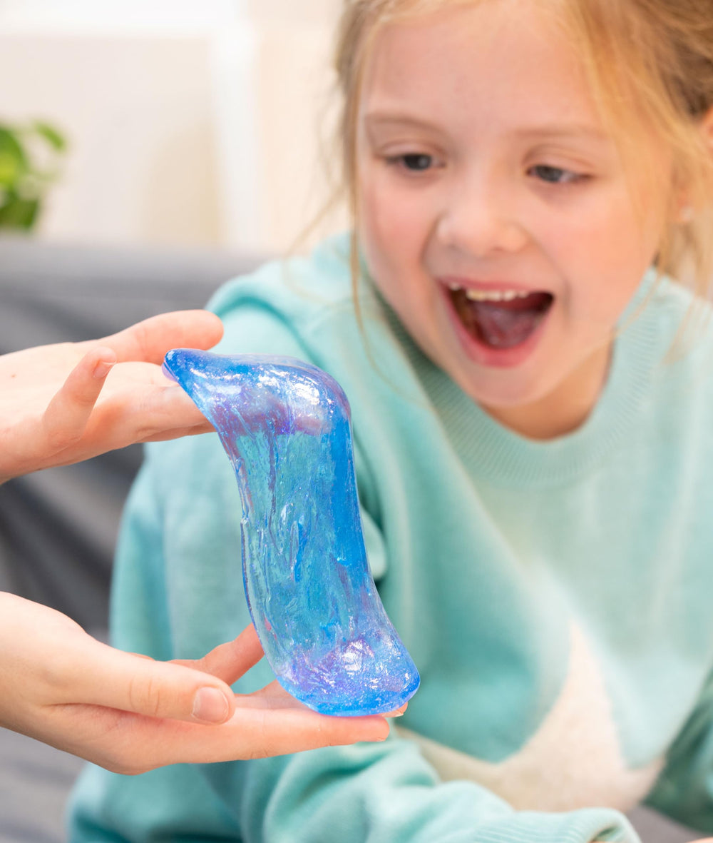 Crazy Aaron's Putty liquid-glass see-through close-up highlights glassy transparency for sensory exploration.