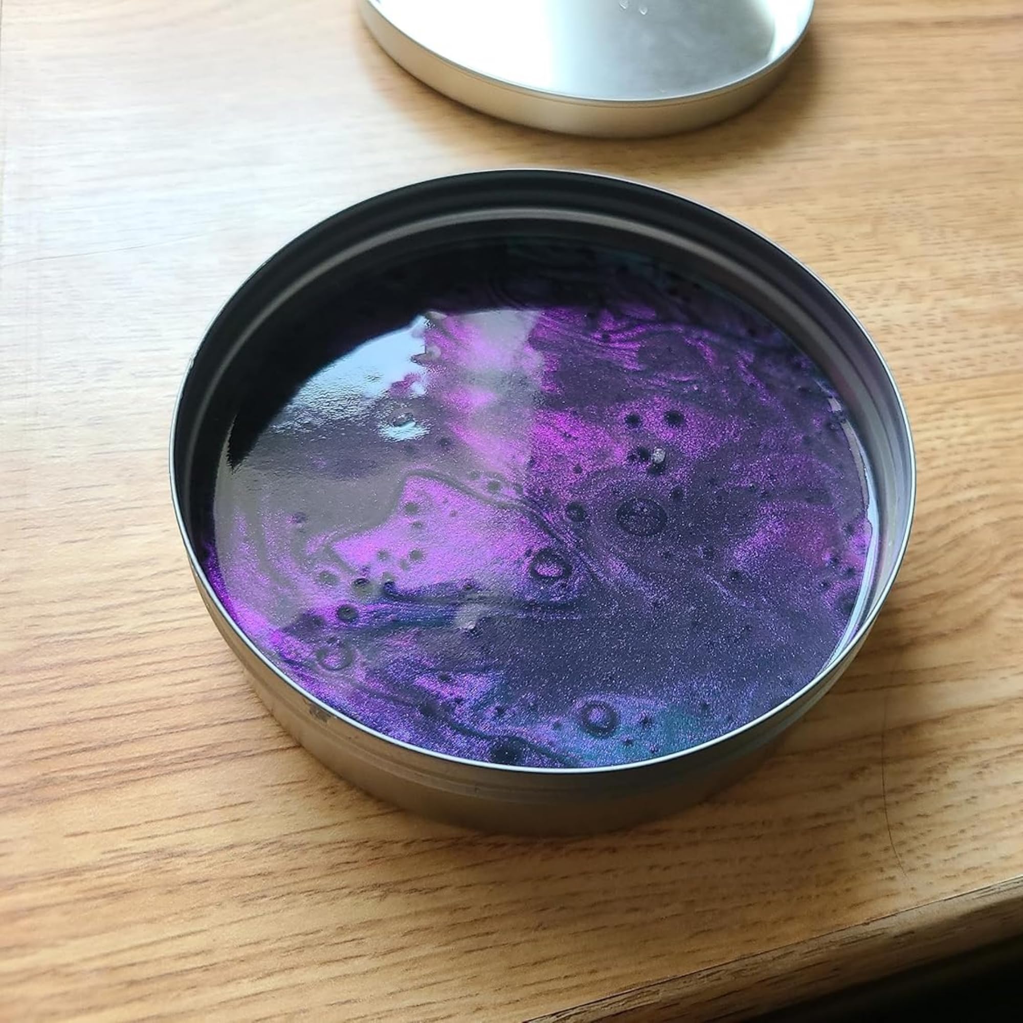 Crazy Aaron's Thinking Putty Super Scarab angle shift highlights changing colors from light.