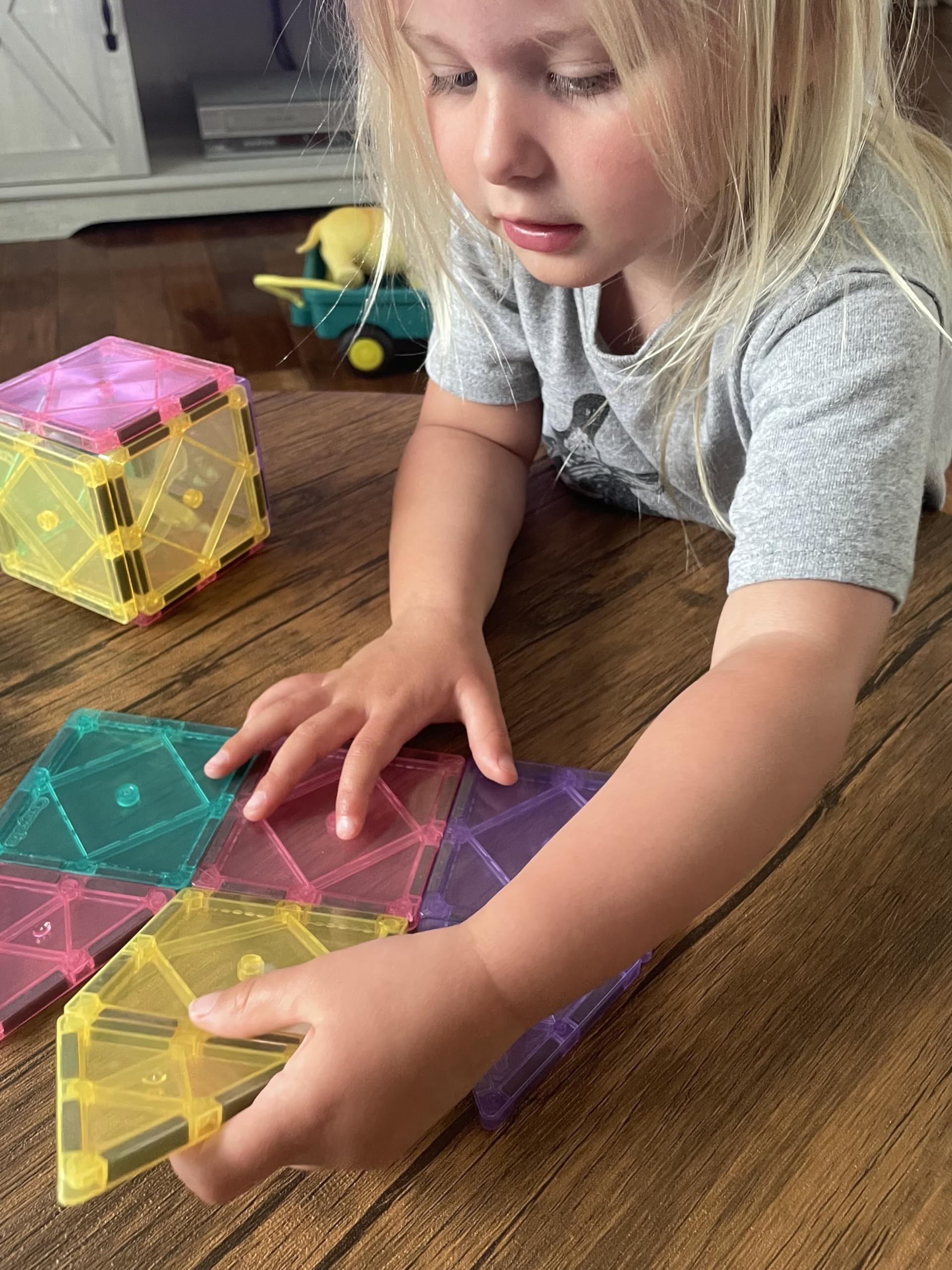 CreateOn Crayola magnetic tiles pastel child playing with color patterns and shapes.