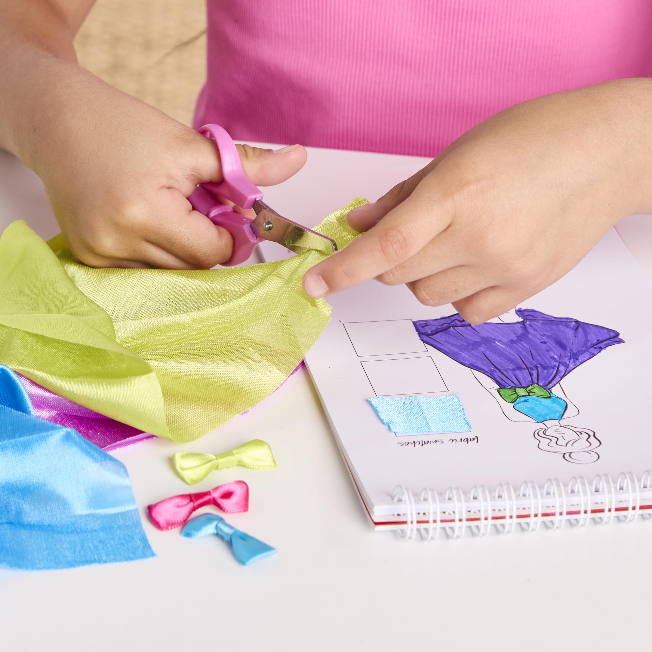 Fashion design manual guiding young designers through sketches and assembly