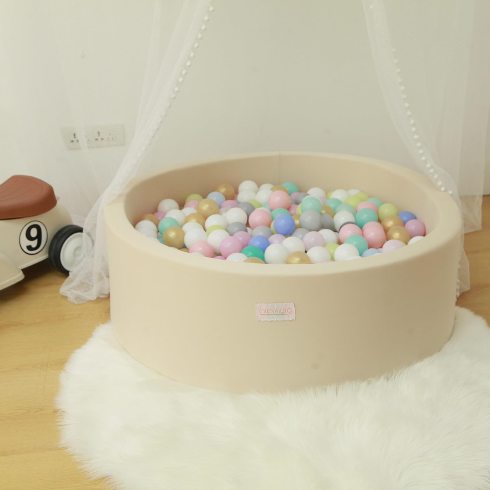 Crenailro family-use ball pit in living room creating a cozy play space