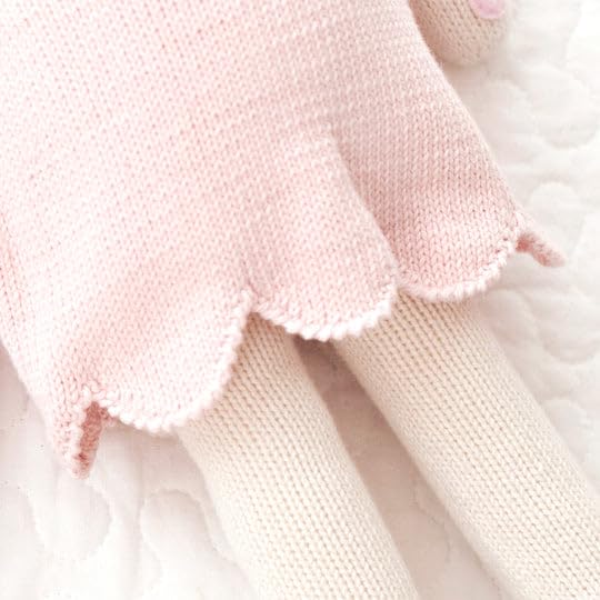 Cuddle + Kind Charlotte dog doll made from 100 percent cotton yarn.