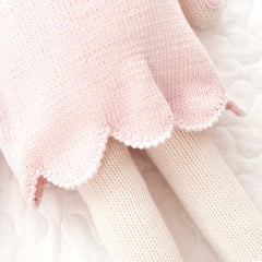 Cuddle + Kind Charlotte dog doll made from 100 percent cotton yarn.