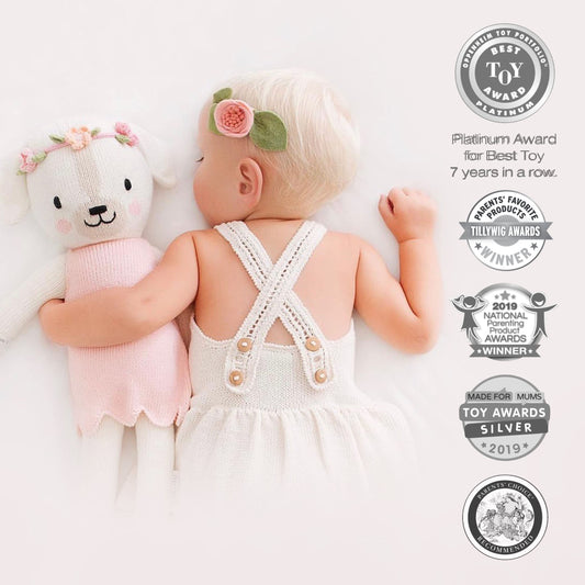 Cuddle + Kind Charlotte doll hand-knit close-up highlighting craftsmanship.