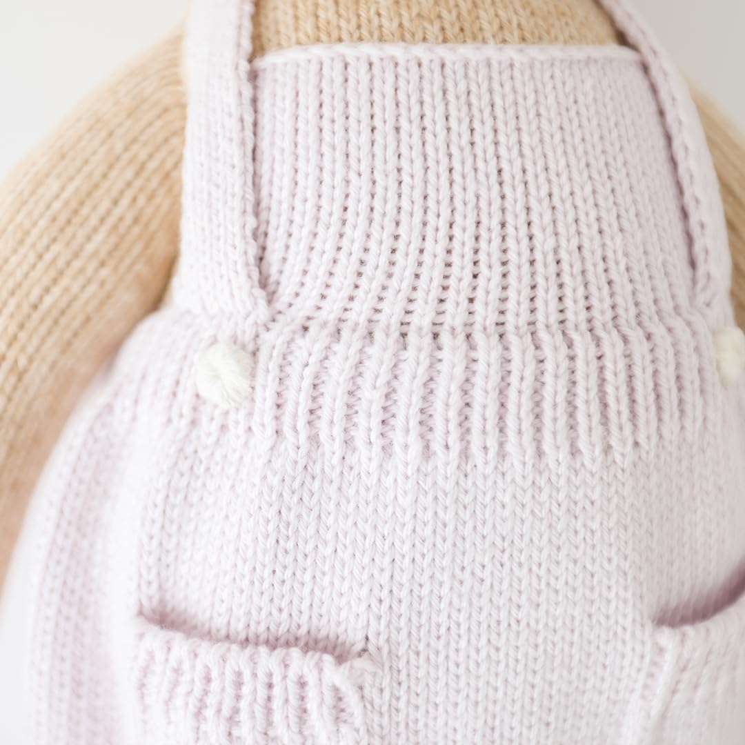 cuddle + kind fair trade craftsmanship tag highlighting women artisans