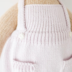 cuddle + kind fair trade craftsmanship tag highlighting women artisans
