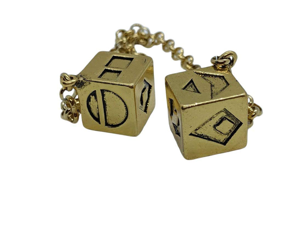 Solid zinc alloy dice with gold plating for premium display