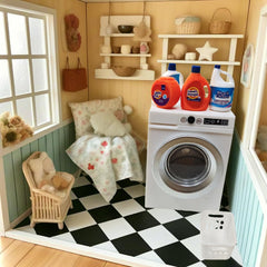 Cyraft white washing basket pairs with machine for complete laundry staging.