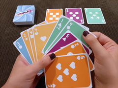 Dad Bomb Games Triples player hand ready for quick decision making.