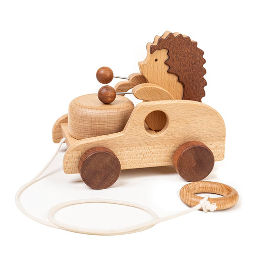 DadCarved Hedgehog pull-along toy with drum-arms promotes rhythm and walking exploration.