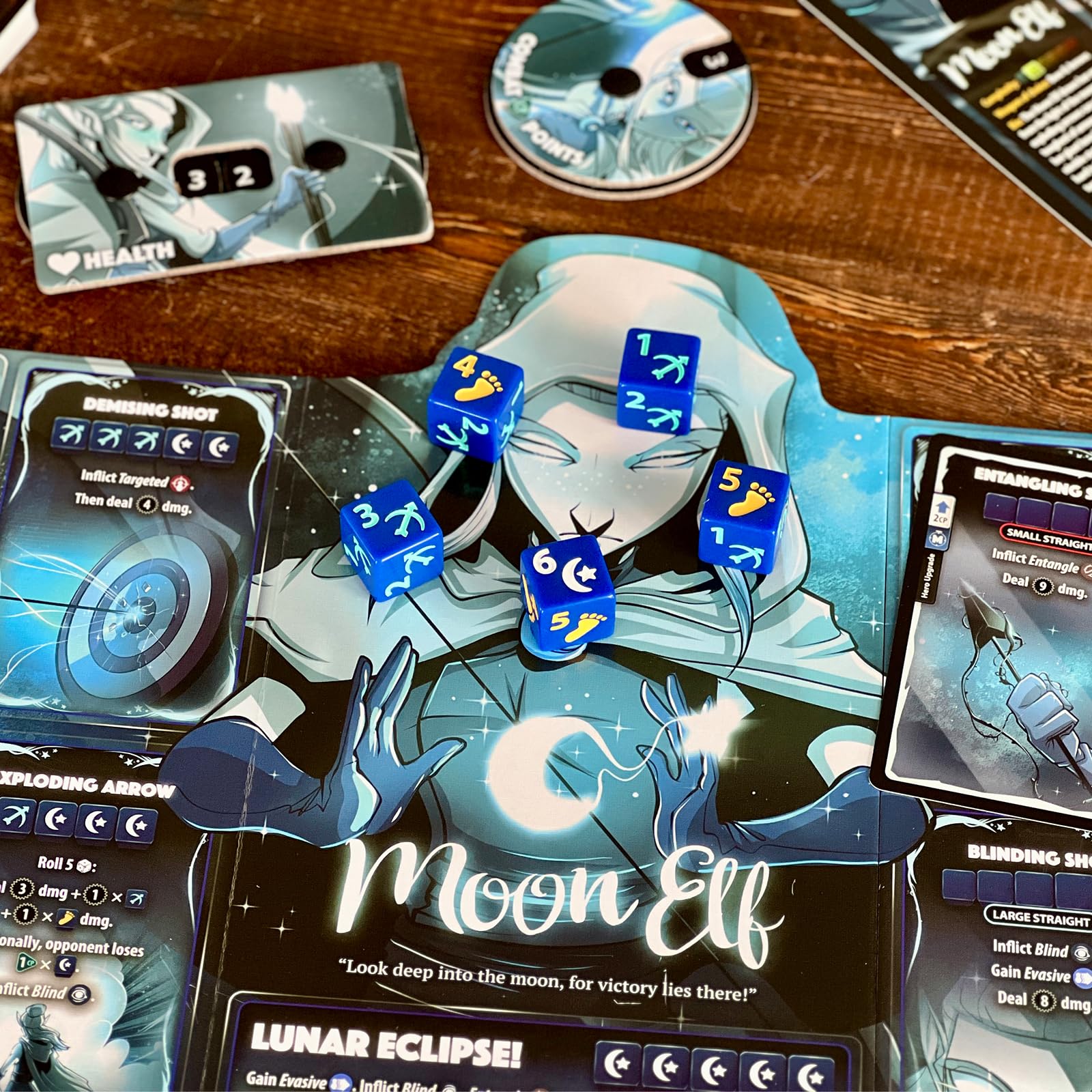 Dice Throne battle box components including dice, cards, and tokens