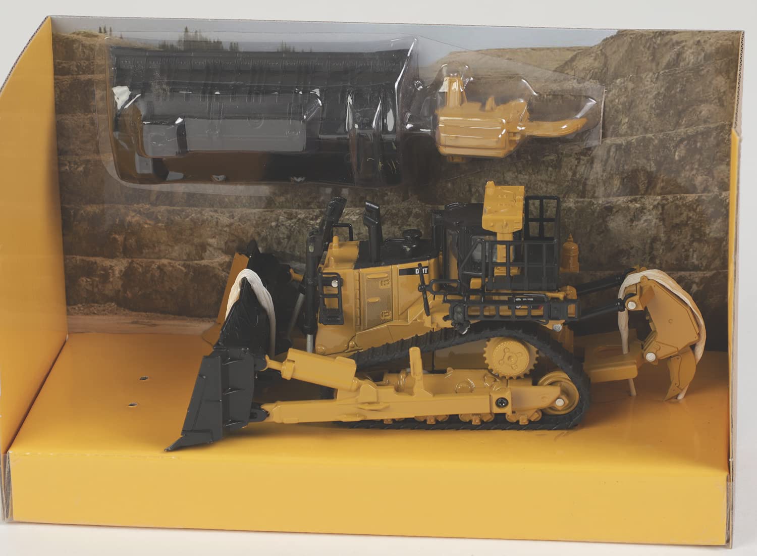 Diecast Masters CAT D11 dozer side view showing two blades and rippers for display versatility.