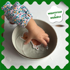DINO MINI Stick4Ever spiral-bound book showing seven dinosaur scenes.
