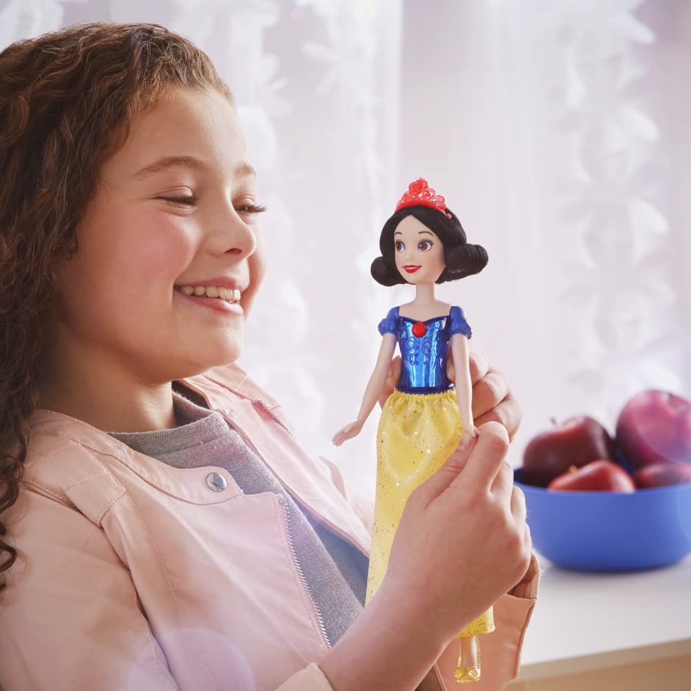 Sparkly skirt on Snow White doll enhances dress-up looks.