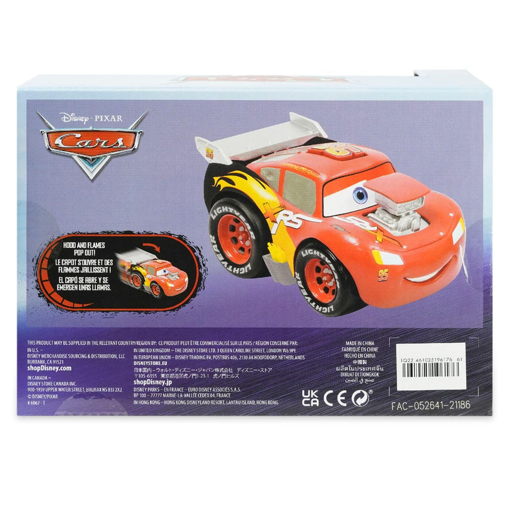 Disney Store Lightning McQueen push & go toy — side view highlighting action features