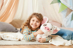 Disney Store Pua plush sized at 13 inches for easy holding.