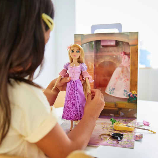 Rapunzel doll with extra pink satin dress sparks creative dress up sessions