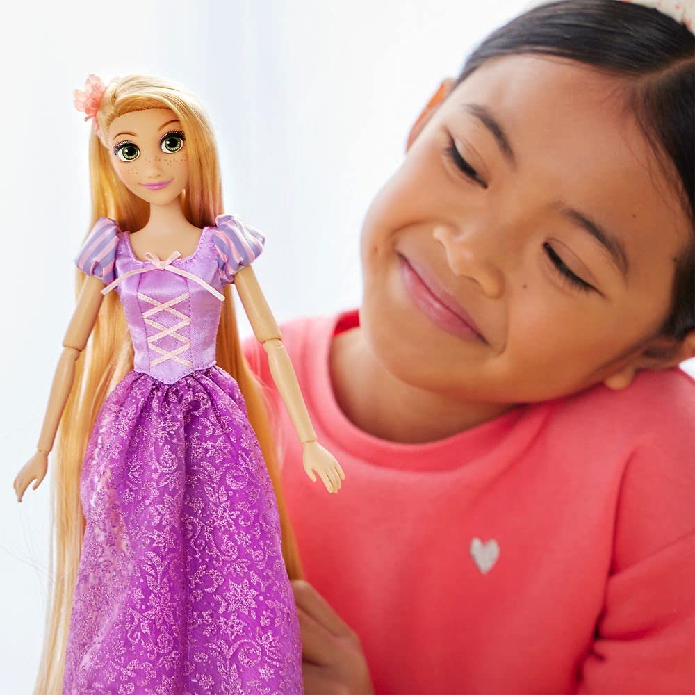 Disney Store Rapunzel doll in satin dress enhances authentic Tangled play.
