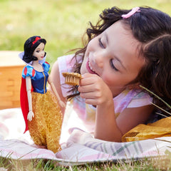 Disney Store Snow White doll in yellow satin skirt inspires colorful pretend adventures.
