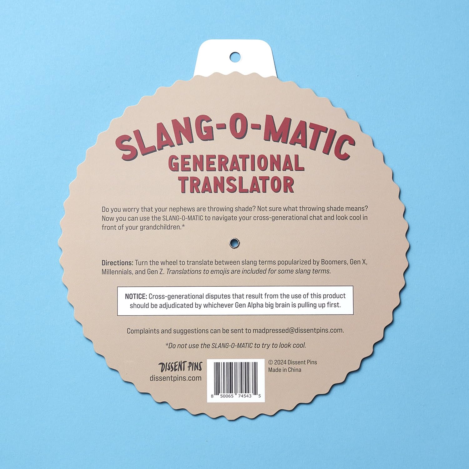 Dissent Pins Slang-o-Matic on a desk as a playful chat accessory.