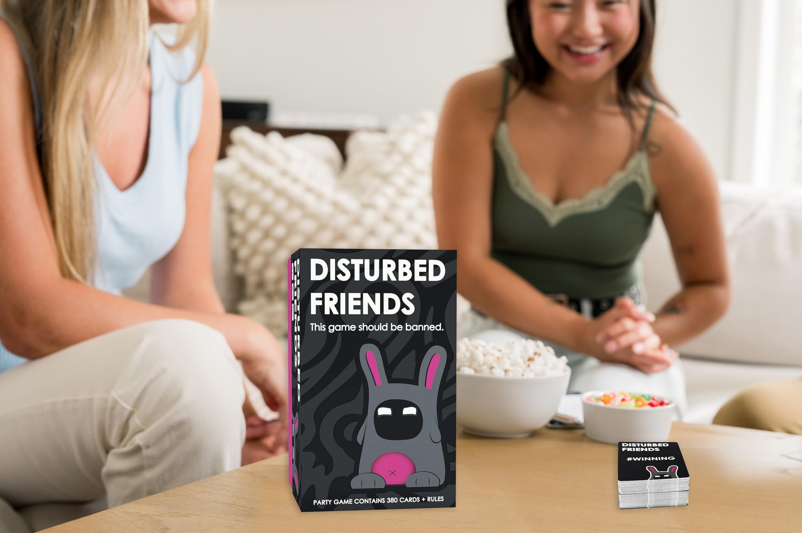 Disturbed Friends vote cards on table during party