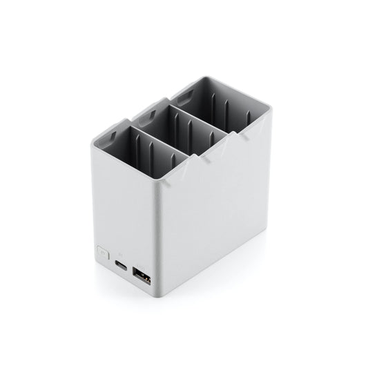 DJI 30W USB-C charger connected to hub powering multiple batteries