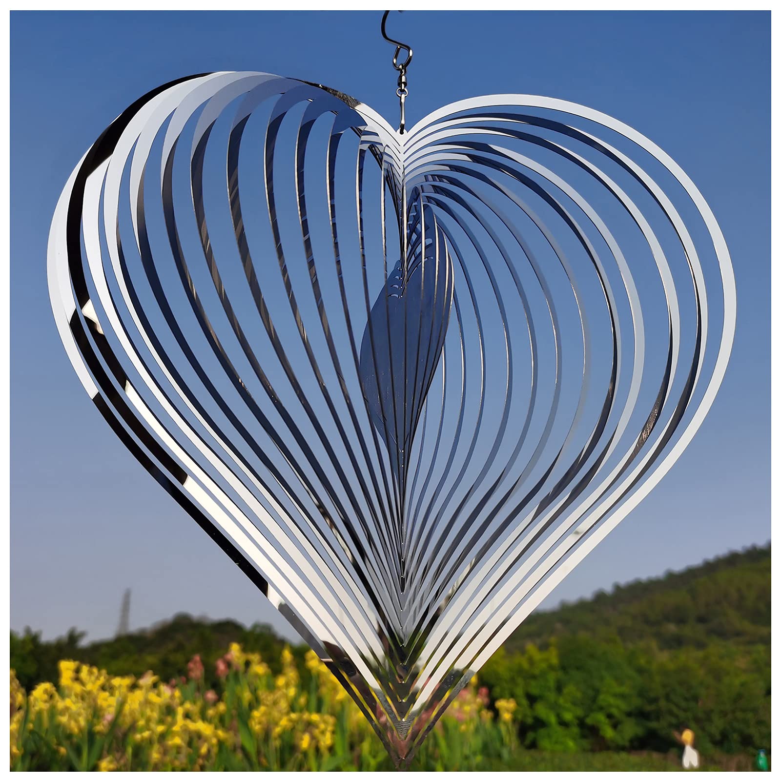 DJUAN silver heart wind spinner outdoors adds reflective motion to your garden.