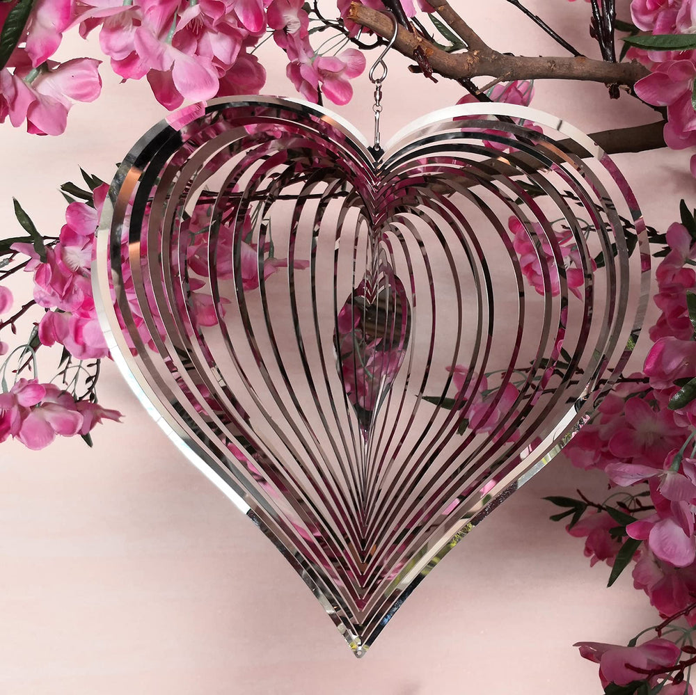 DJUAN wind spinner with stainless steel finish creates a three-dimensional glow in the breeze.