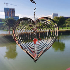 DJUAN garden wind spinner hooks on trees, walls, or rails.