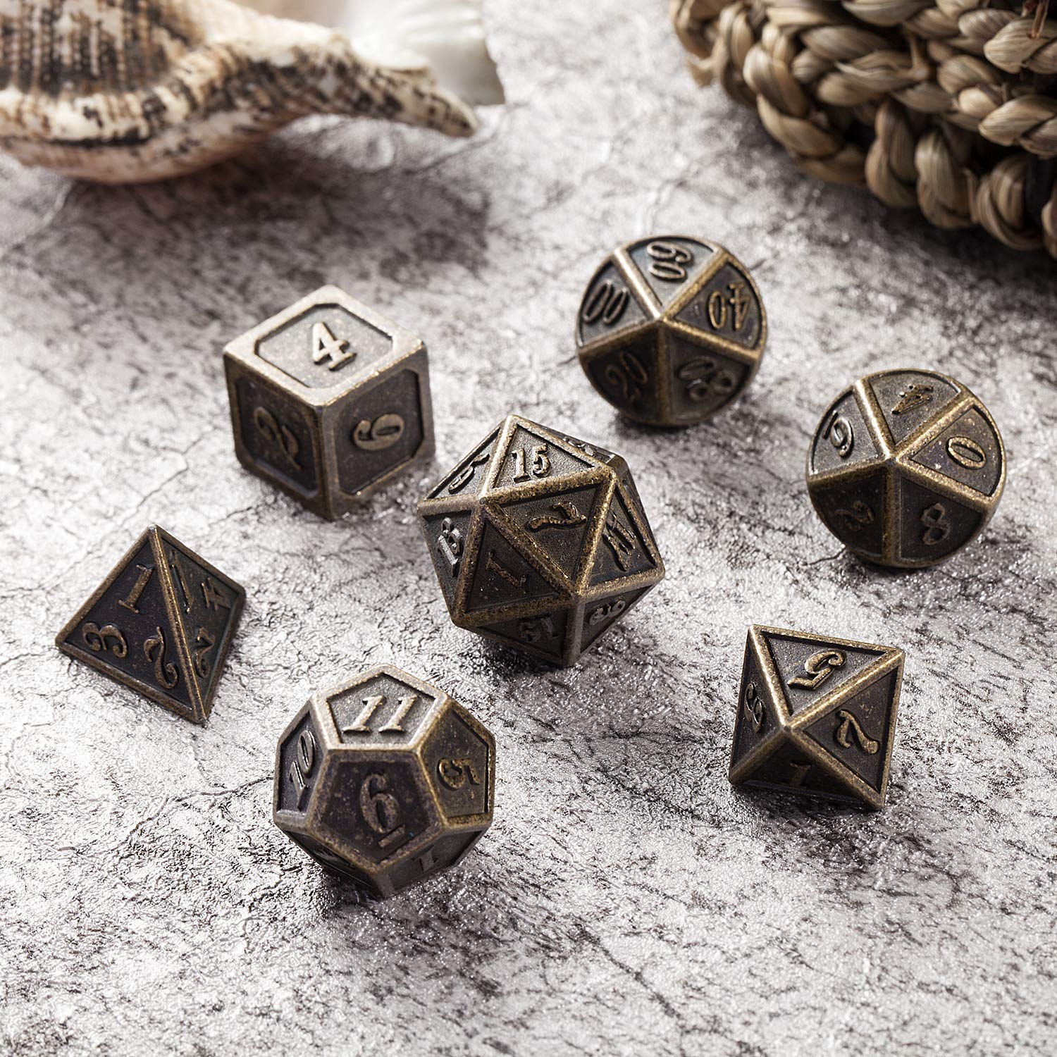 DnDnD D4 brass die close-up highlighting crisp engravings for reliable reads.
