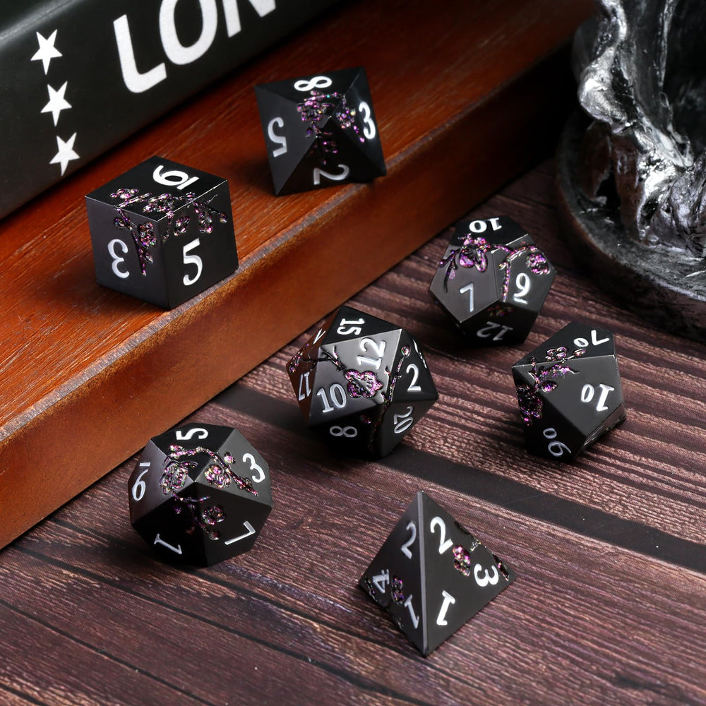 DNDND matte black dice closeup showing durable zinc alloy coating.