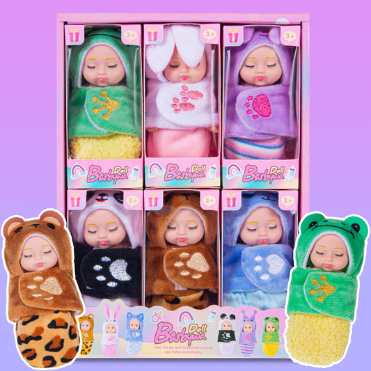 Dollbie frog mini doll with sleeping bag for imaginative play.