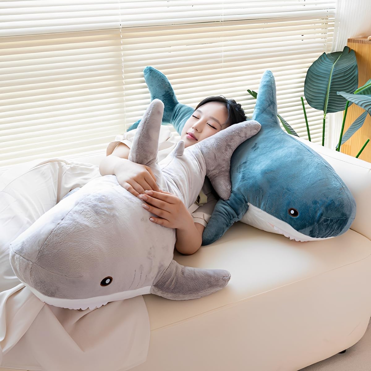 DongAi plush shark pillow side view in blue ideal for naps.