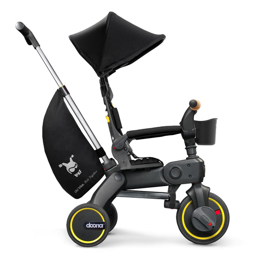 DOONA Liki Trike S5 Nitro Black folded for easy stowage on trips