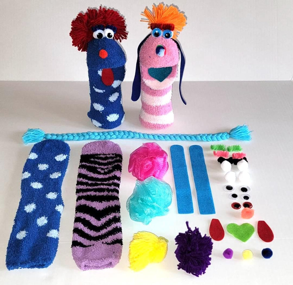 Doopalpoops kit materials spread shows socks, eyes, mouths and hair pieces ready for crafting