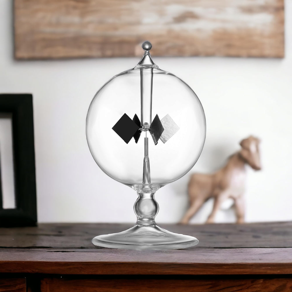 DORAMI crystal-clear glass radiometer with spinning vanes for modern decor.