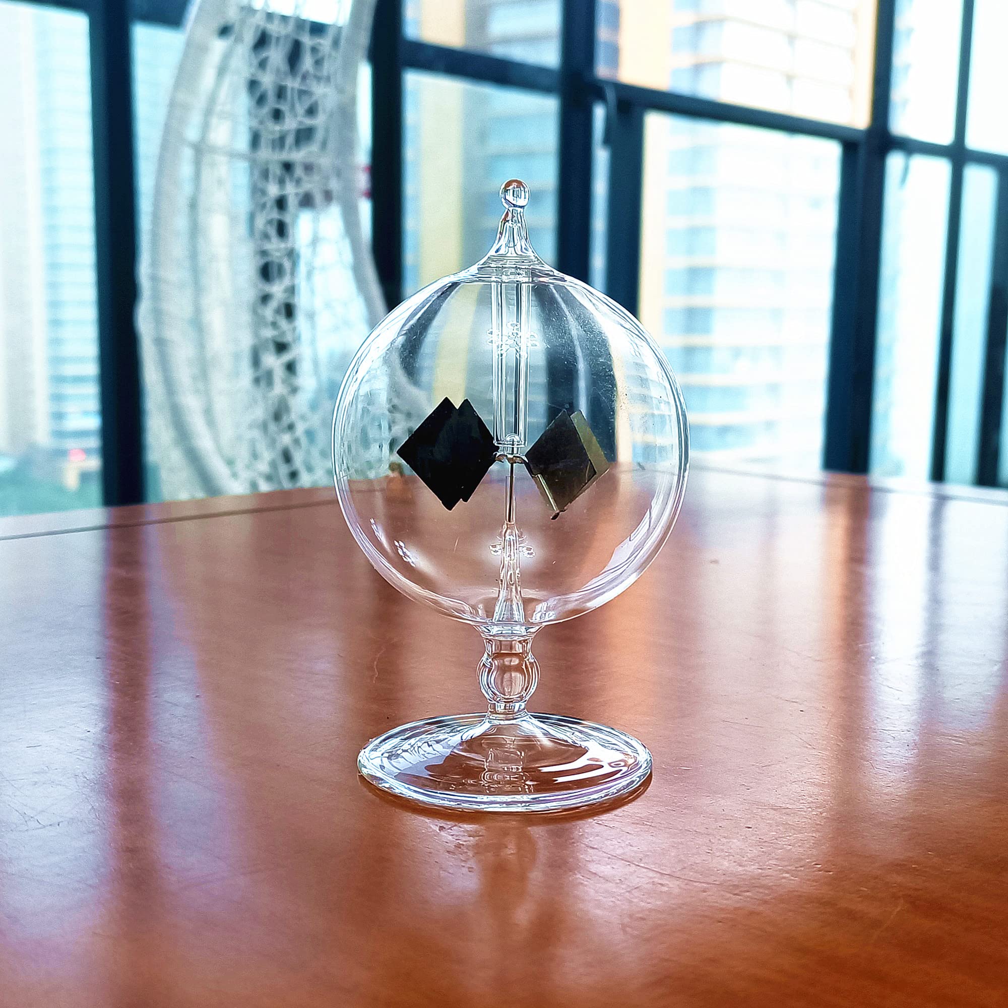 DORAMI windowsill display radiometer spinning with ambient light at home or office.