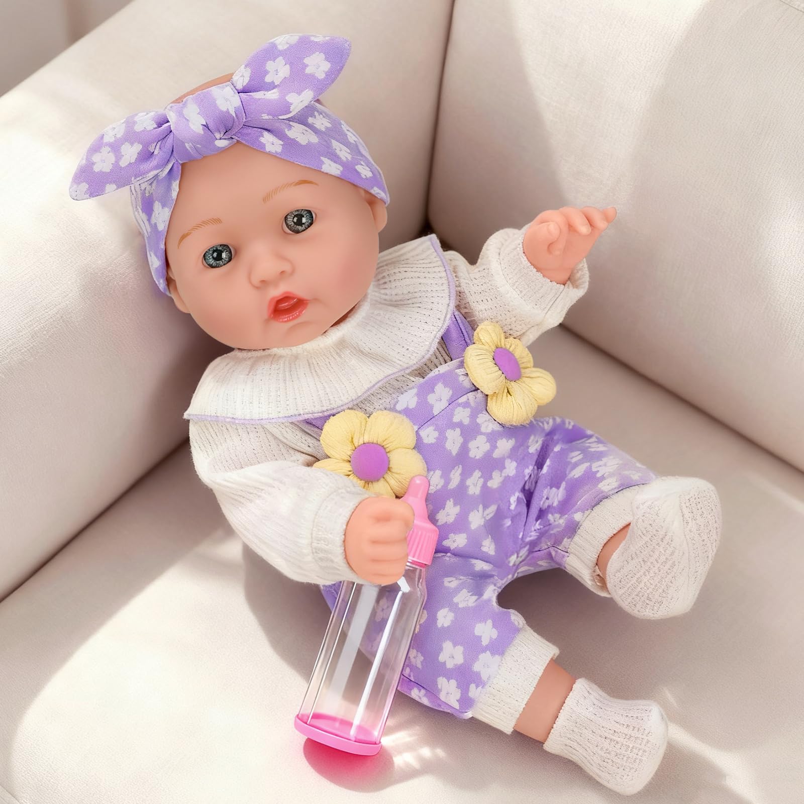 DOTVOSY doll with feeding bottle highlights nurturing role-play possibilities.