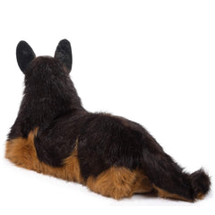 Douglas Major plush sits comfortably on sofa or bed.