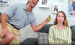 DR DINGUS Dad Joke Pickle Button at a family game night setting.