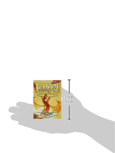 Hand holding Dragon Shield yellow sleeves for on-the-go card protection.